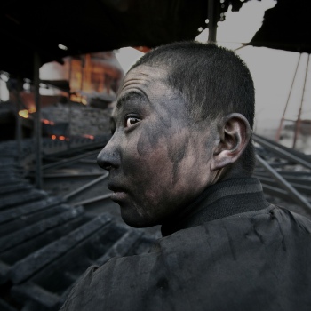 Lu Guang Worker in a small smeltering factory Wuhai City Inner Mongolia 2005