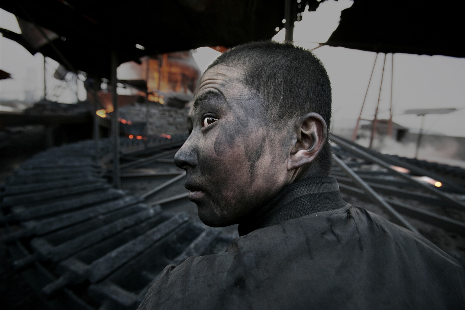 Lu Guang Worker in a small smeltering factory Wuhai City Inner Mongolia 2005